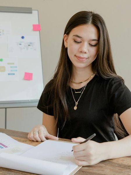 Female business analyst reviewing project requirements